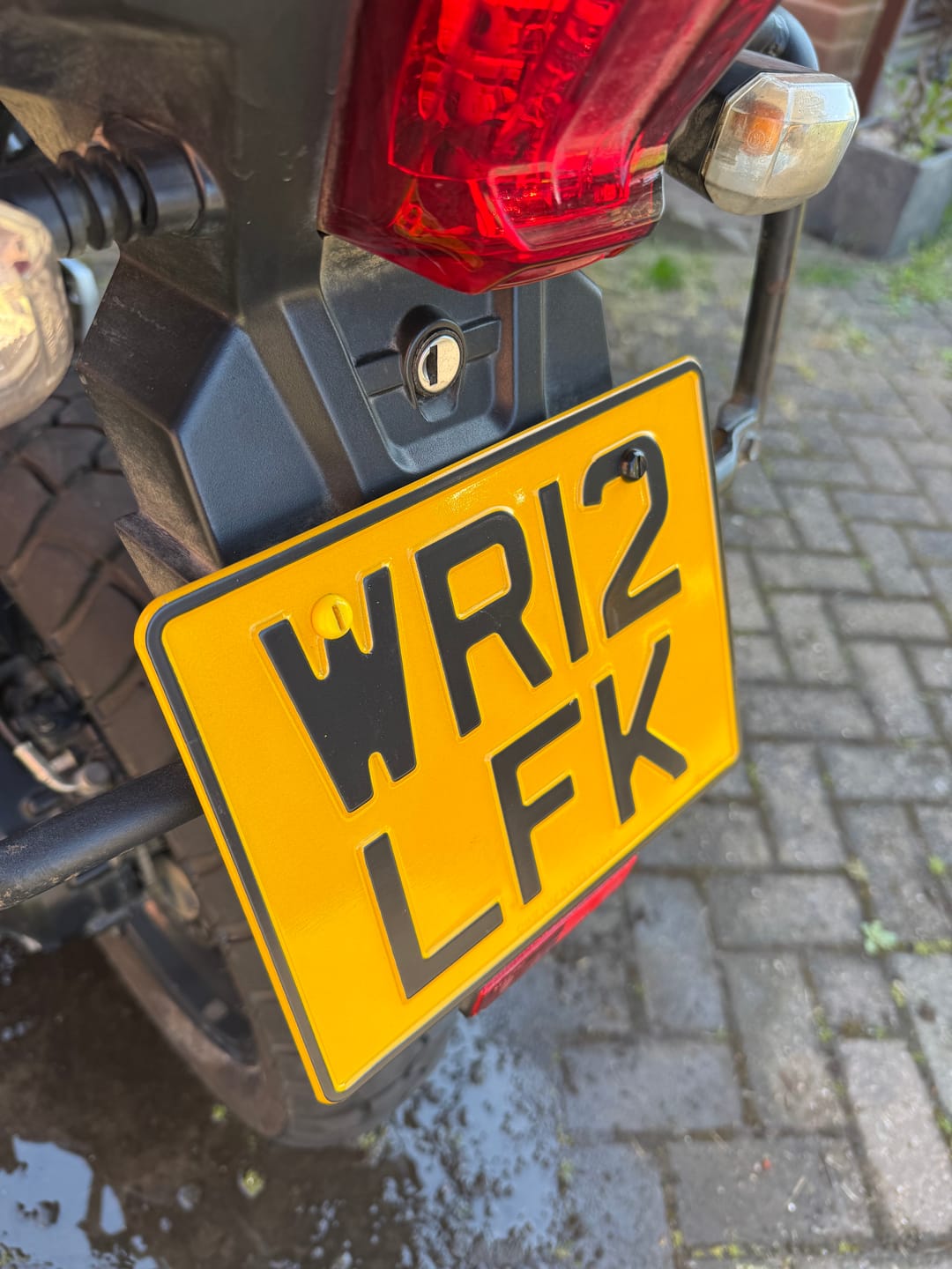 Customer photo review of Metal Pressed Motorcycle Number Plate – 9 x 7 Inches
