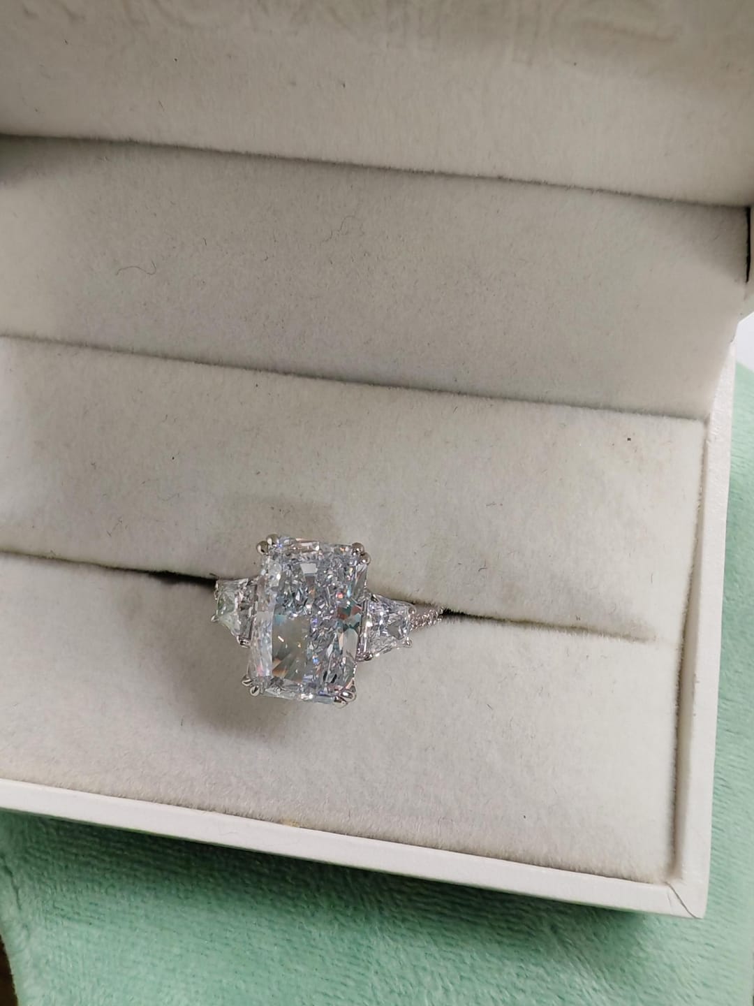 Customer photo review of Louily Gorgeous Three Stone Crushed Ice Radiant Cut Engagement Ring
