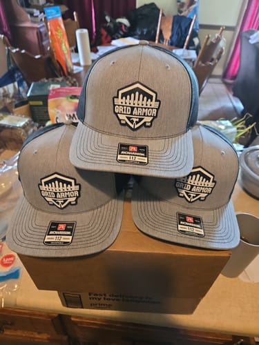 Customer photo review of Custom Leather Patch Trucker Hat - Richardson 112