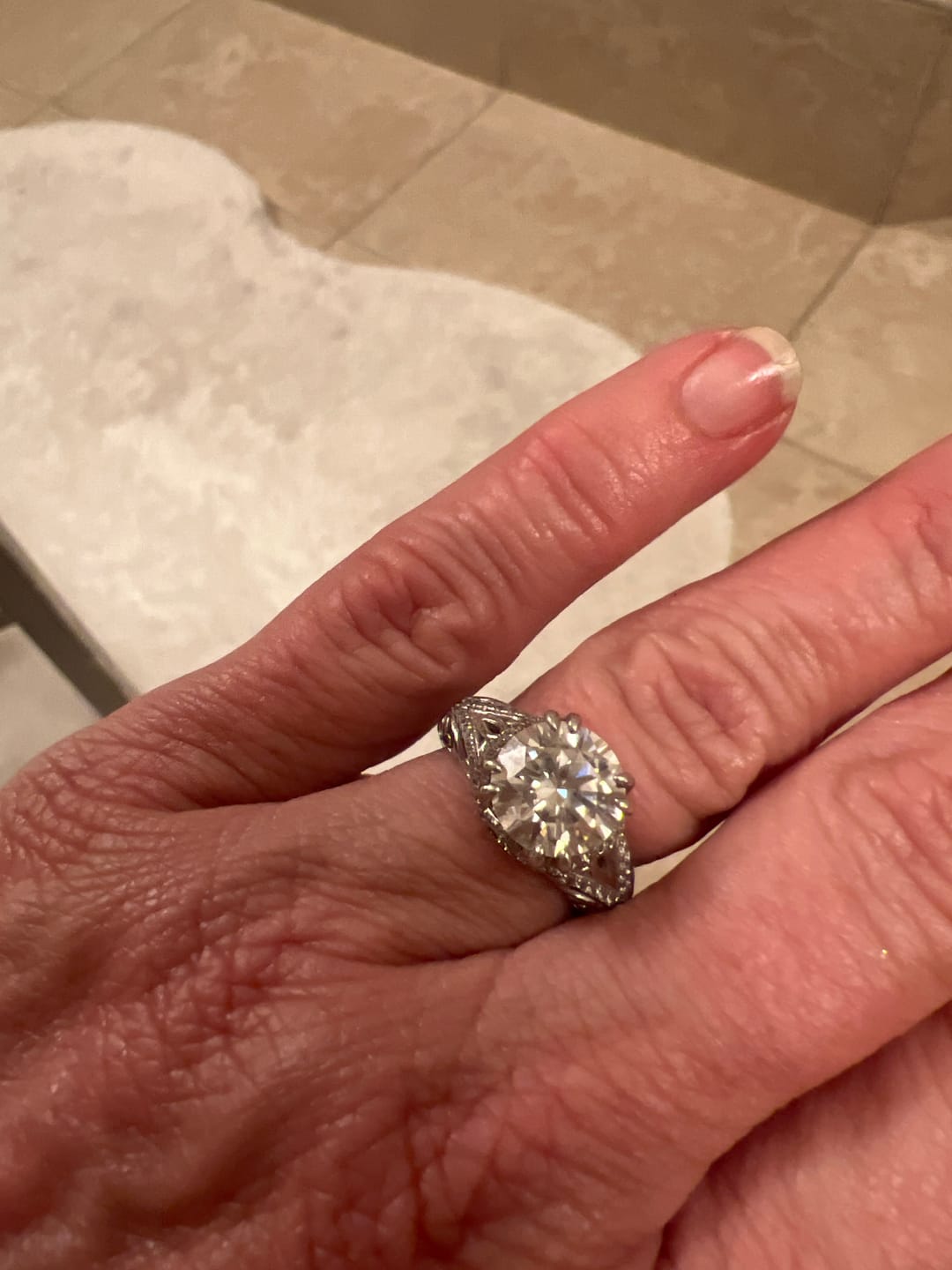 Customer photo review of Vintage Moissanite Pave Open Scroll Accents Engagement Ring