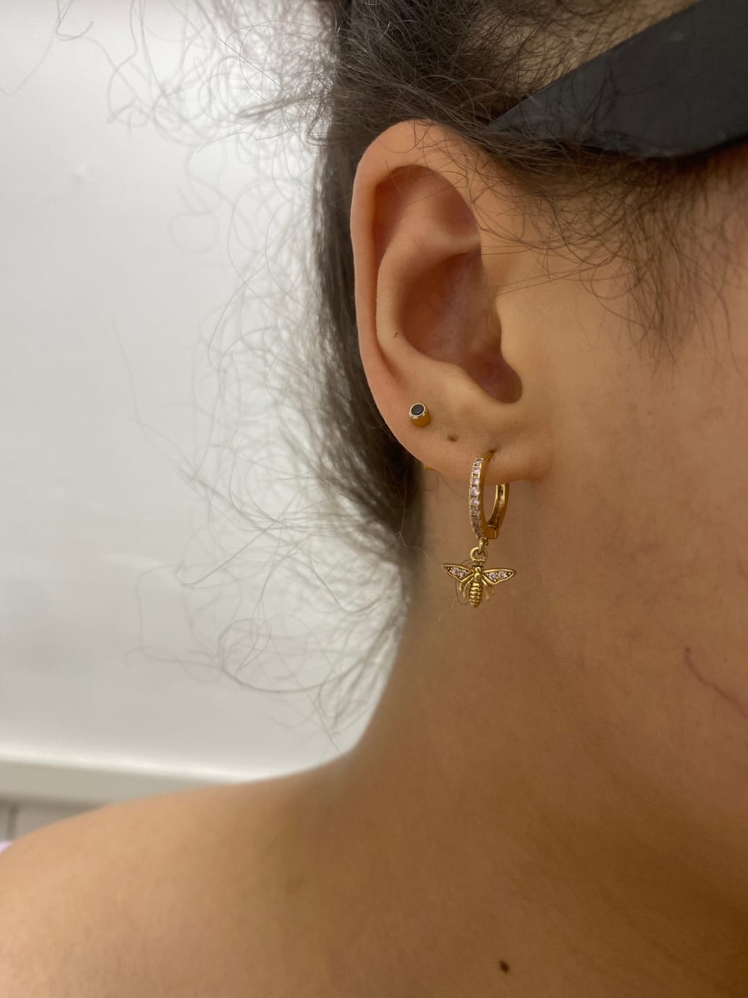 Customer photo review of Ines Pink Gold Bee Huggie Earrings