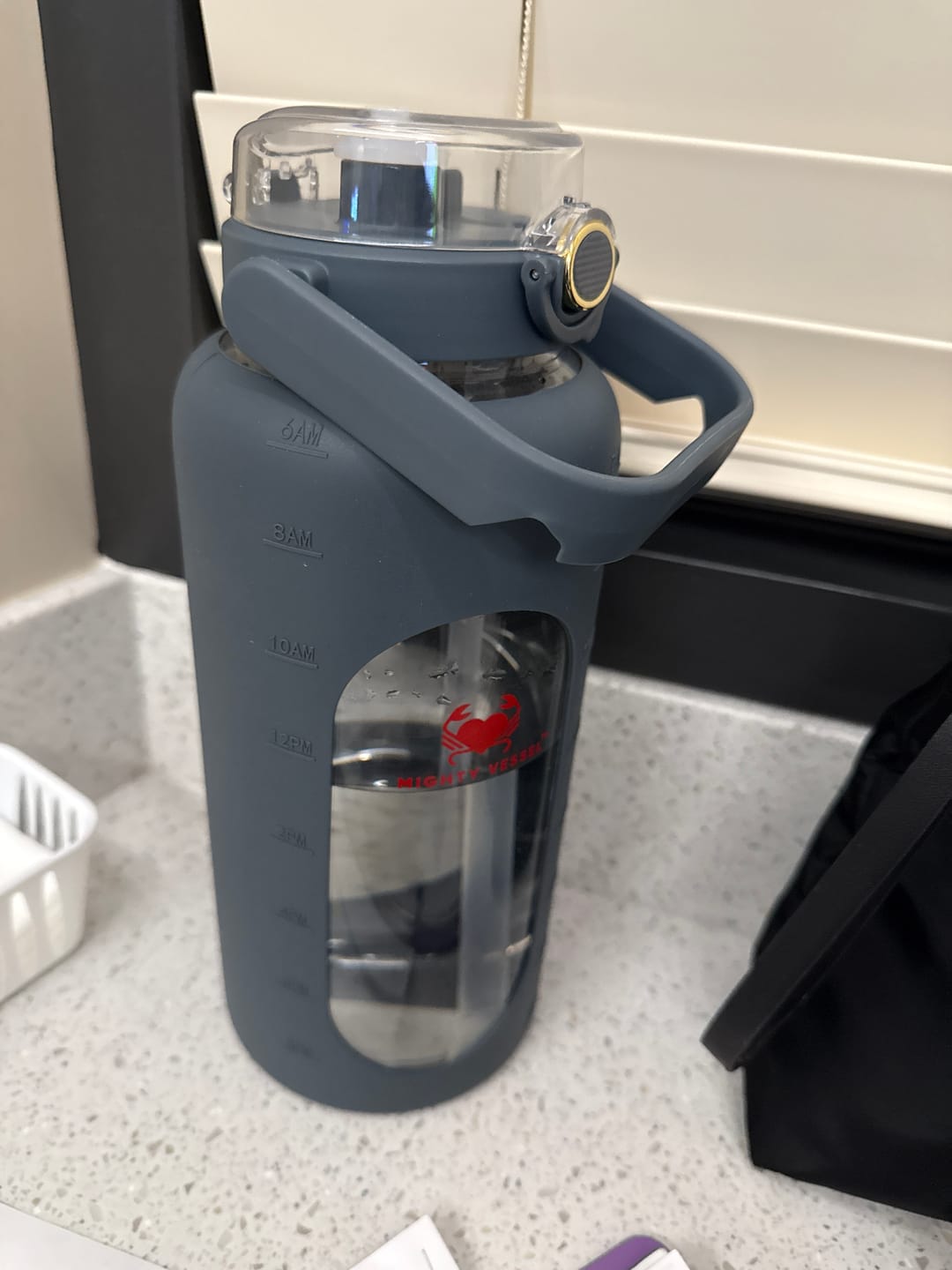 Customer photo review of MIGHTY VESSEL™ SHATTER-RESISTANT GLASS WATER BOTTLE | 64 OZ