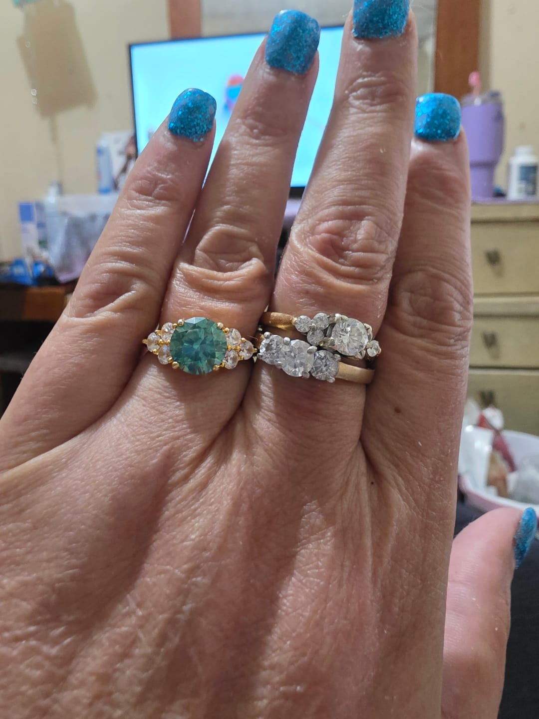 Customer photo review of Green Moissanite Side Stone Engagement Ring