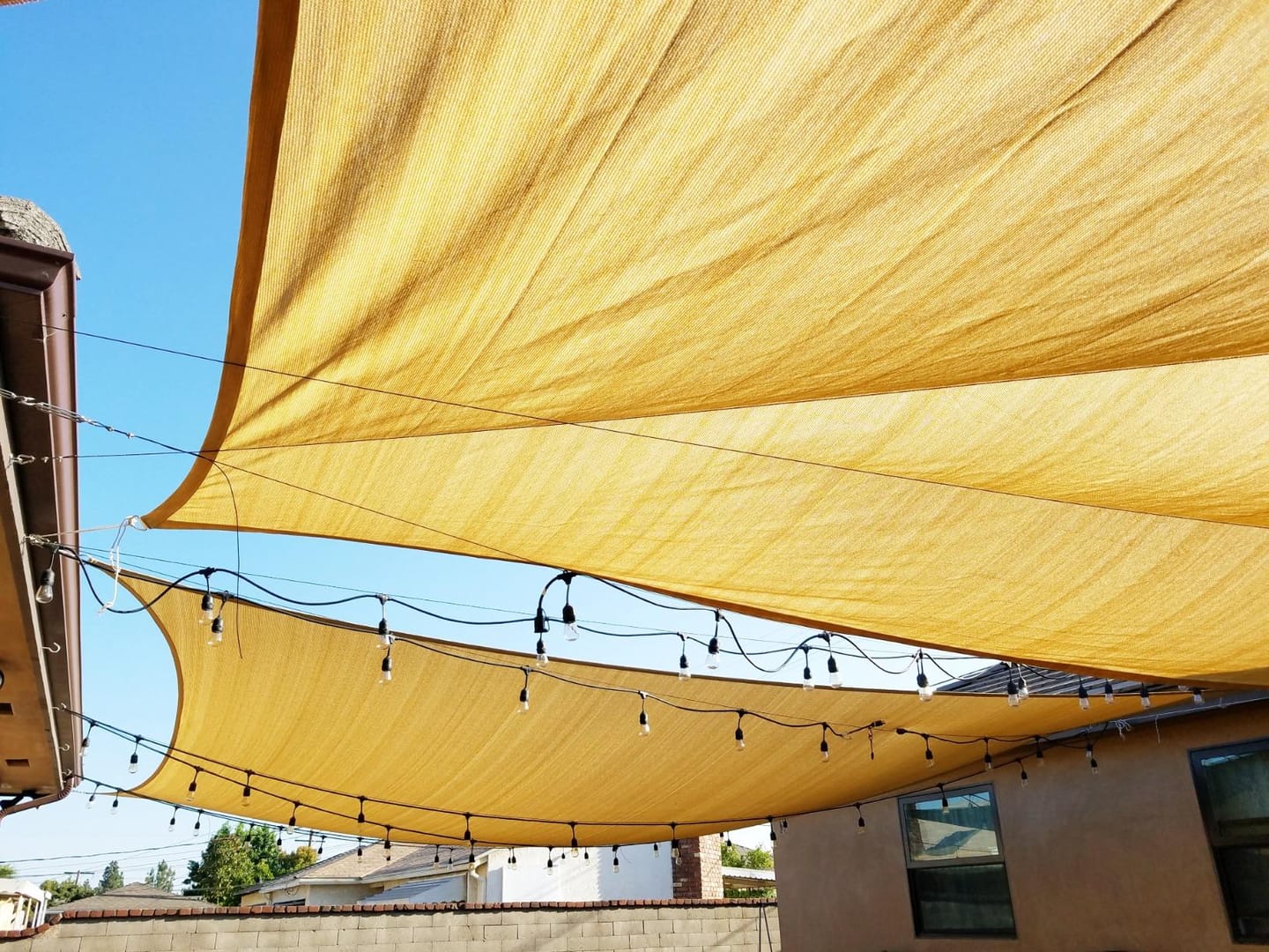 Customer photo review of Custom Sized HDPE Breathable UV Block Triangle Sun Shade Sail for Patio/Pool