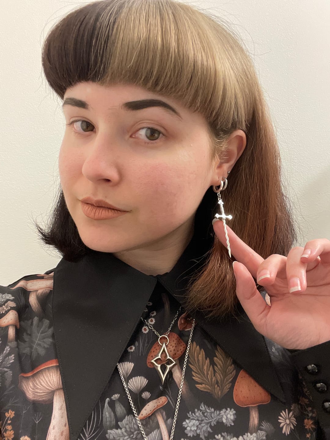 Customer photo review of Wavy Sword Earrings