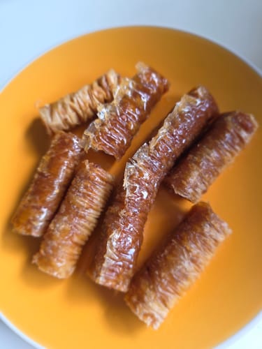 Customer photo review of Traditional Greek Saragli – Rolled Baklava with Almonds (8 pieces – 250g)