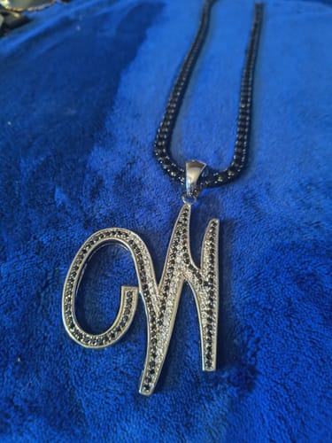 Customer photo review of Flat Cursive Initial Letter Black & White CZ Iced Out Pendant