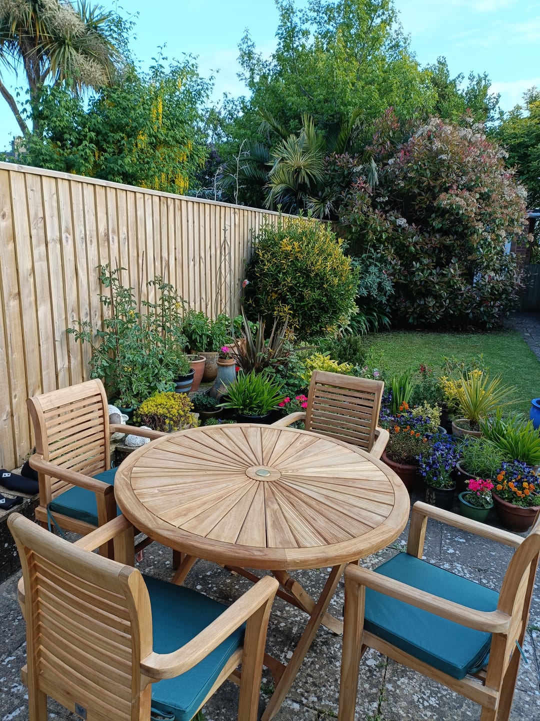 Customer photo review of Teak Garden Furniture Set 120cm Round Sunshine Table 4 x Oxford Stacking Chairs Cushions Included