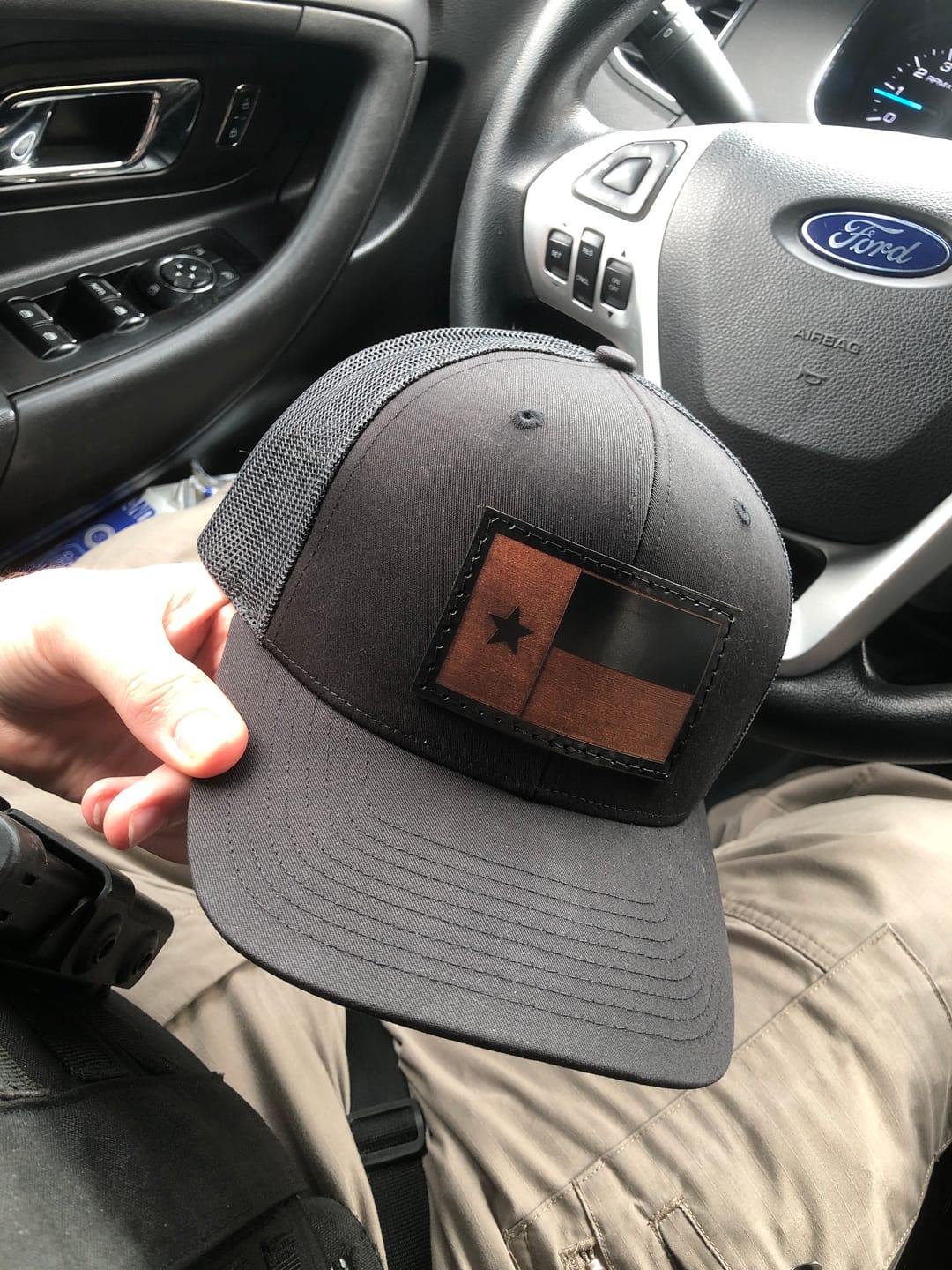 Customer photo review of Texas State Flag - Black on black Leather Patch Trucker Hat
