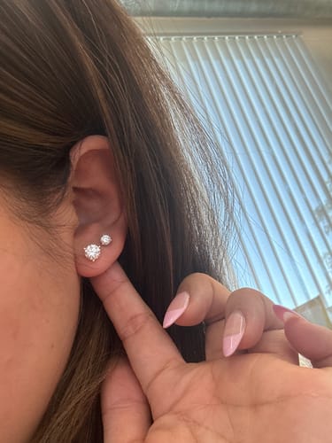 Customer photo review of M & Co. 3-Prong Martini Setting Diamond Stud Earrings