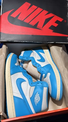 Customer photo review of Air Jordan 1 High OG UNC Reimagined