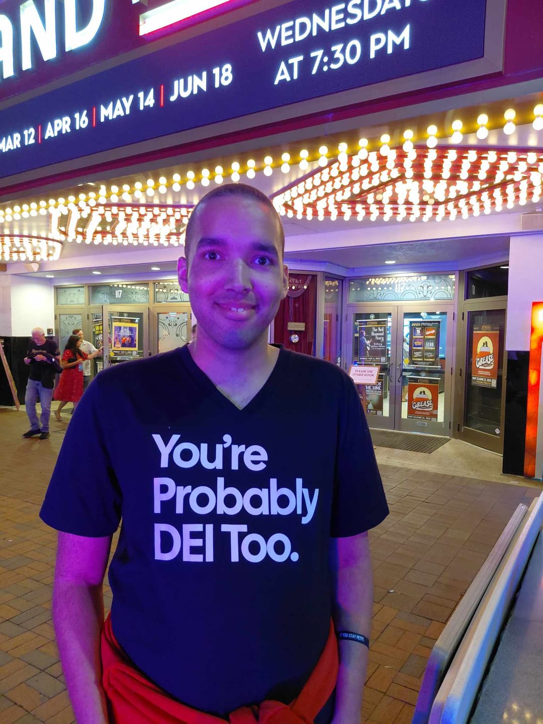 Customer photo review of You're Probably DEI Too *BLACK V-NECK* Unisex Tee (Front and Back Design Print)