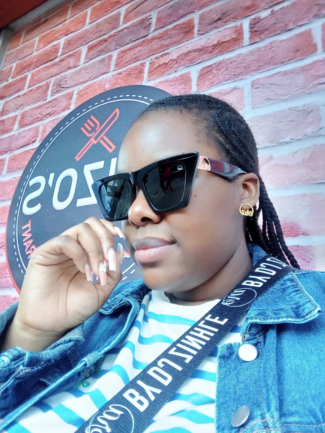 Customer photo review of Black Diva Logo Sunglasses