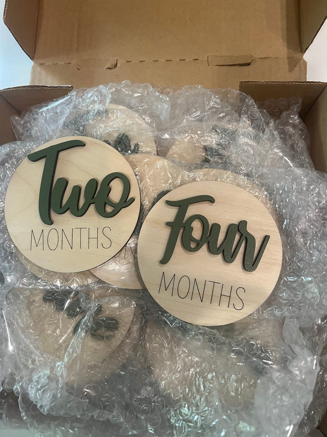 Customer photo review of Wooden Monthly Baby Milestones