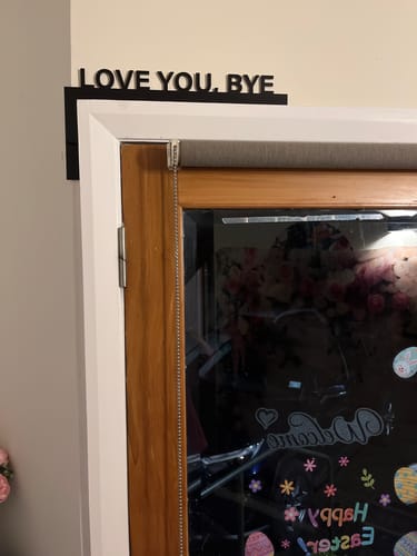 Customer photo review of Love You Bye Door Frame Sign
