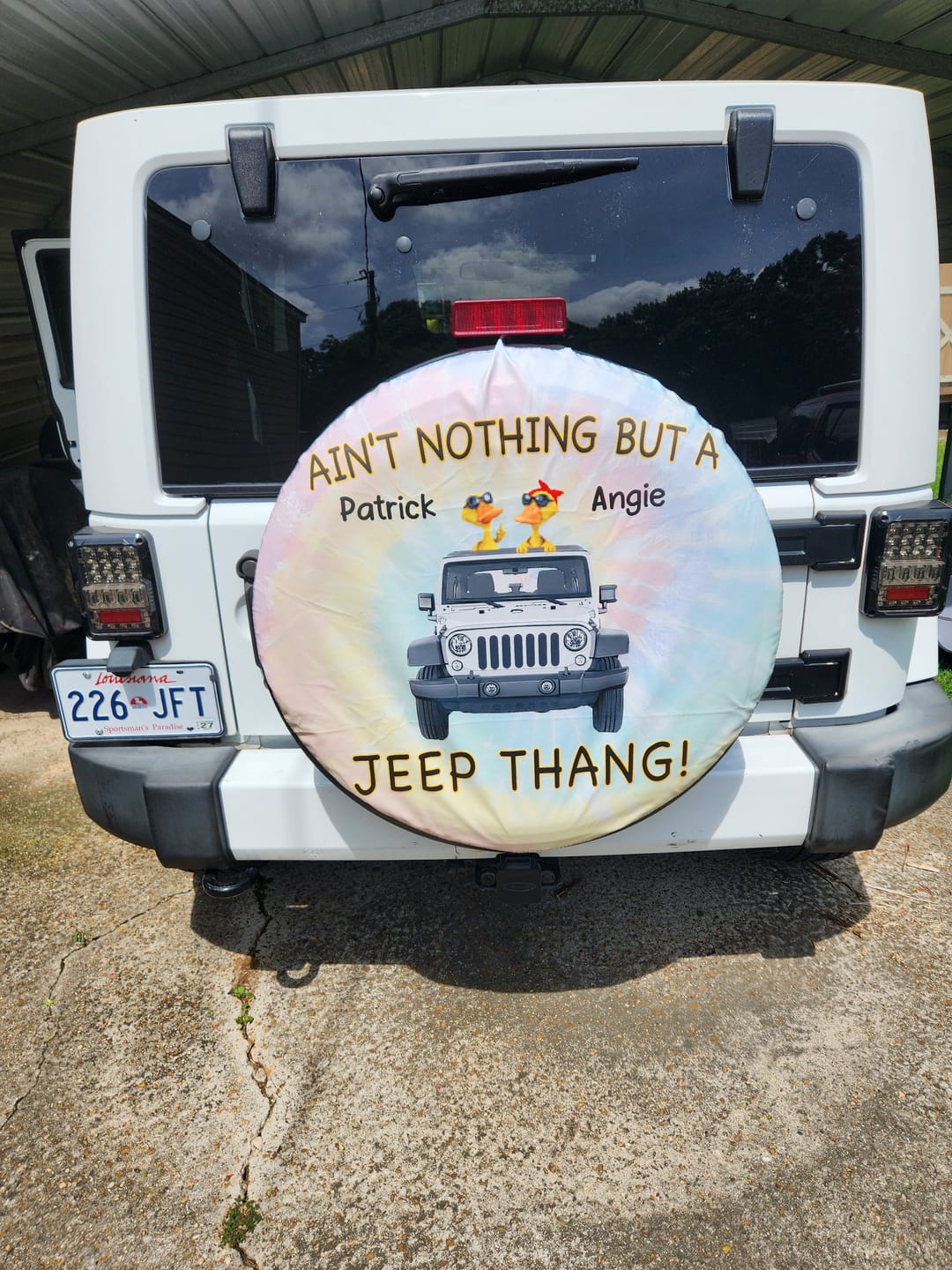 Customer photo review of Custom JP Tire Cover With Camera Hole, Aint Nothing But A JP Thang Tide Dye Spare Tire Cover CTM