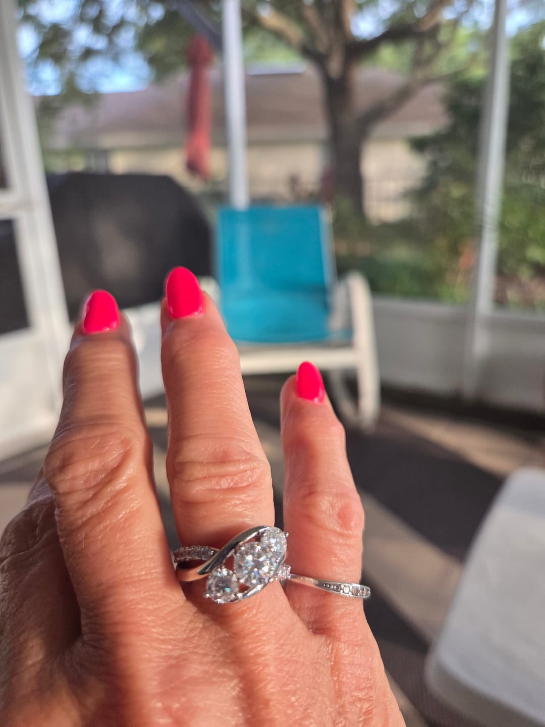 Customer photo review of Swirl Three Stone Moissanite Twisted Pave Engagement Ring