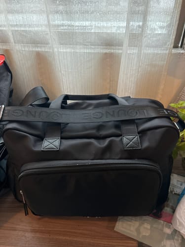 Reseña con foto de un cliente sobre Bolso Maternal