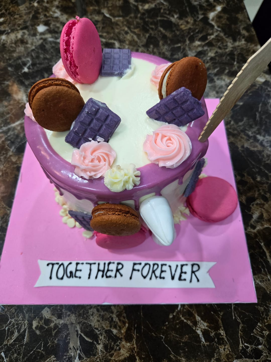 Customer photo review of Purple Drip Macaron Cake
