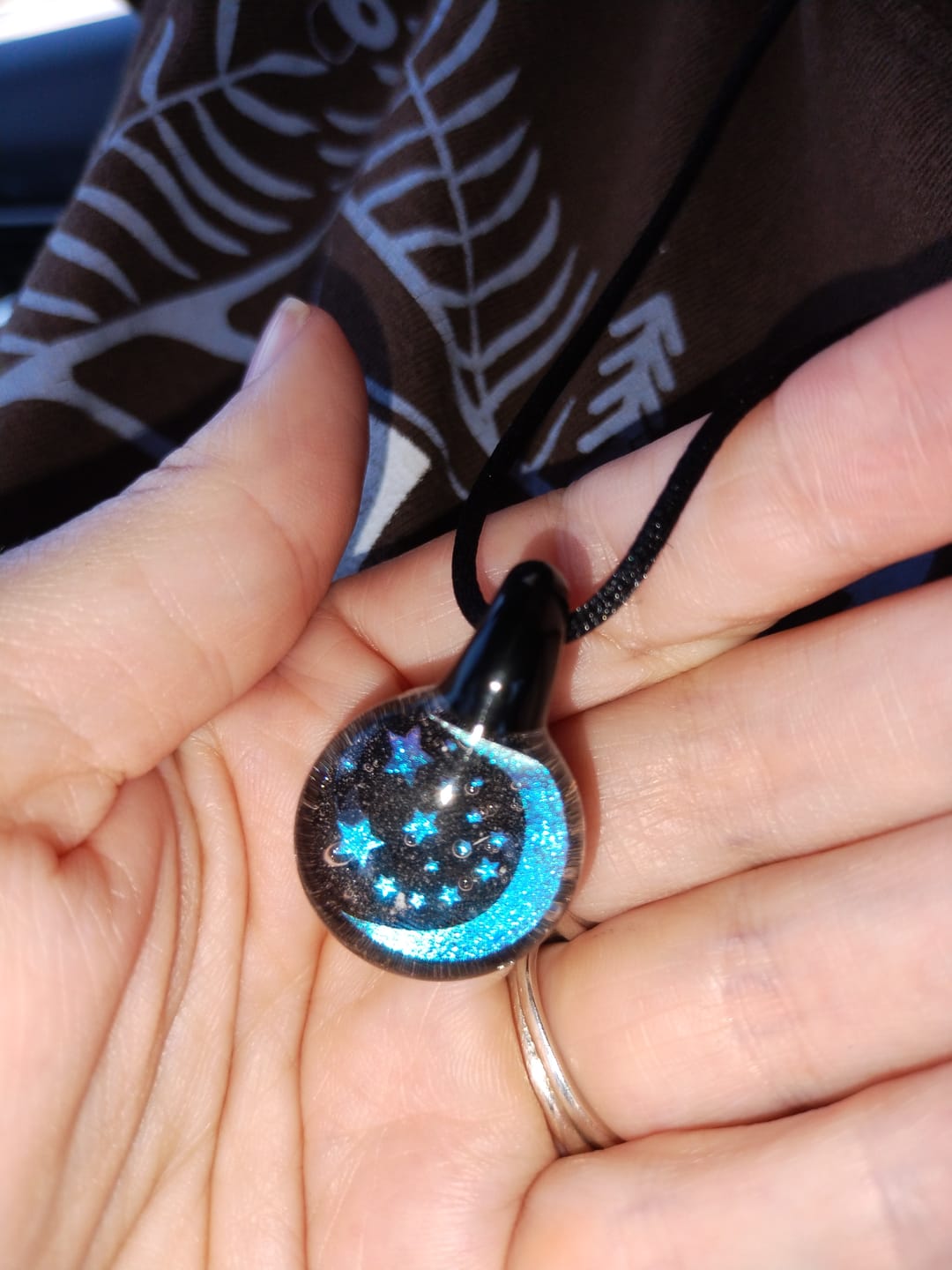 Customer photo review of Moon and Stars Hologram Pendant with Infused Cremation Ash