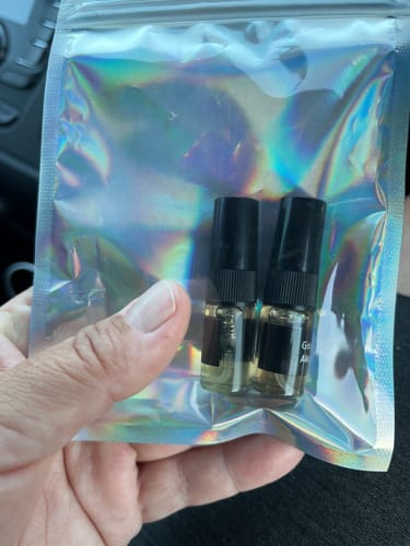 Customer with fragrance bottles