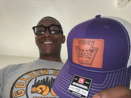 Customer photo review of Custom Leather Patch Trucker Hat - Richardson 112