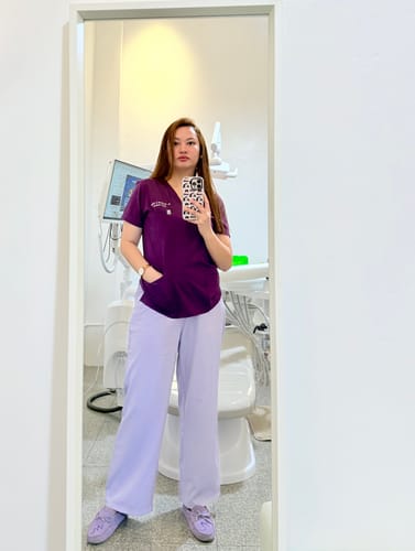 Customer photo review of 5-Pocket MoveTech® Scrub Top - Women / Plum