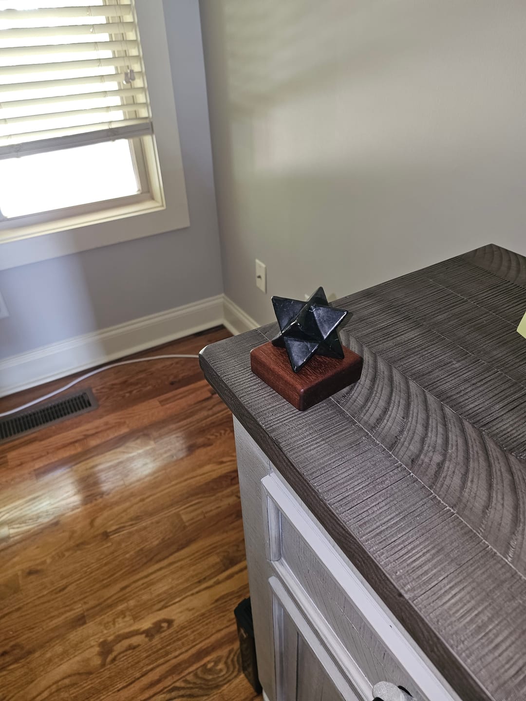 Customer photo review of Shungite Merkaba, 50mm, Hand Carved, Custom Mahogany Stand