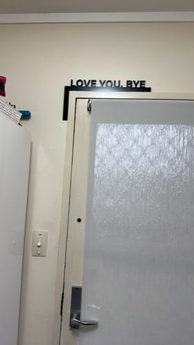 Customer photo review of Love You Bye Door Frame Sign