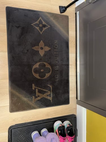 Customer photo review of Louis Vuitton dark logo luxury living room carpet