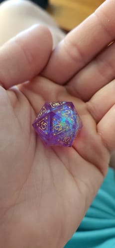 Customer photo review of URWizards D&D Resin Purple Glitter Engraved Dice Set Astrology Style