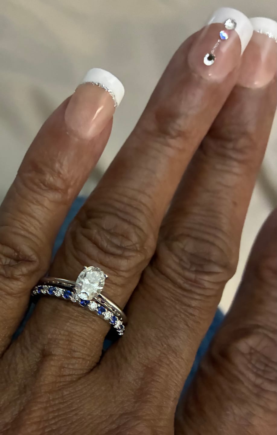 Customer photo review of Alternating Moissanite And Sapphire Eternity Wedding Band Ring