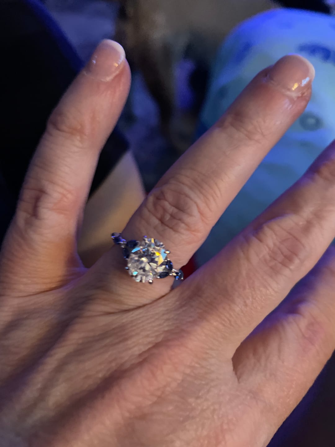 Customer photo review of Oval Cut Moissanite With Marquise Sapphire Petals Accents Engagement Ring