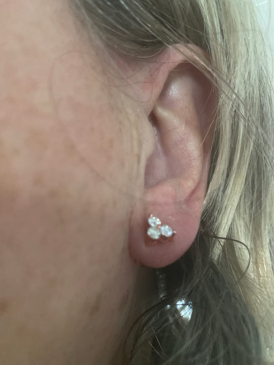 Customer photo review of Trinity Moissanite Sleep Stud Earrings