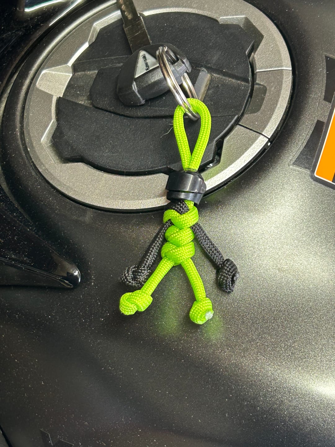 Customer photo review of Black Green Biker Buddy Paracord Keychain