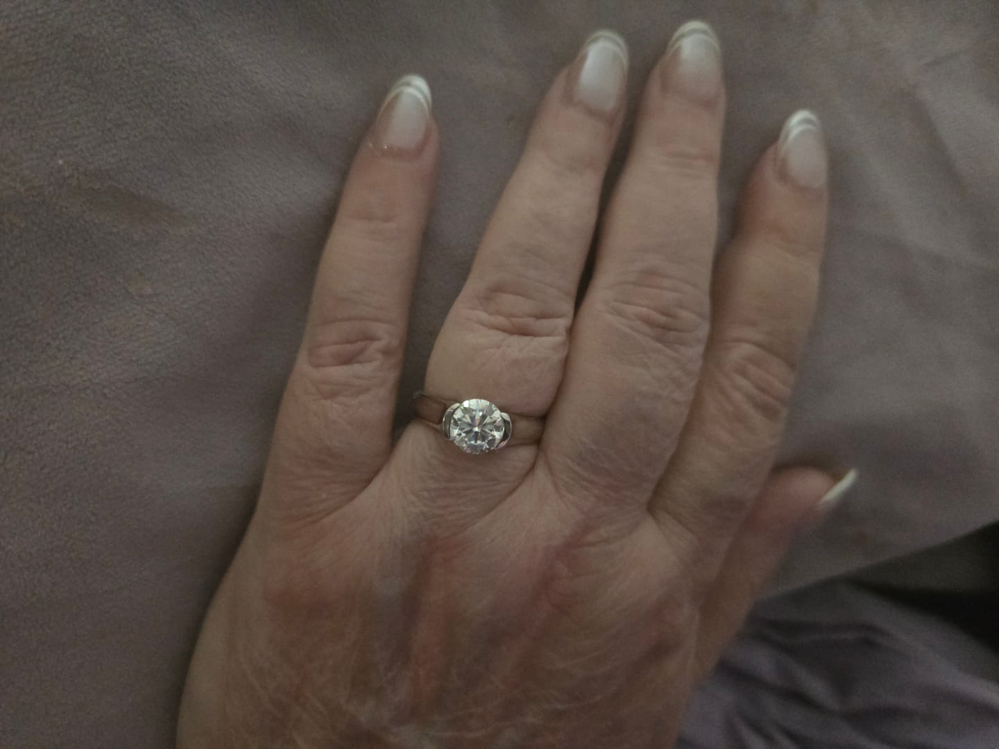 Customer photo review of Solitaire Moissanite Half Bezel Set Sterling Silver Engagement Ring
