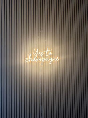 Customer photo review of Yes to Champagne Neon Signs