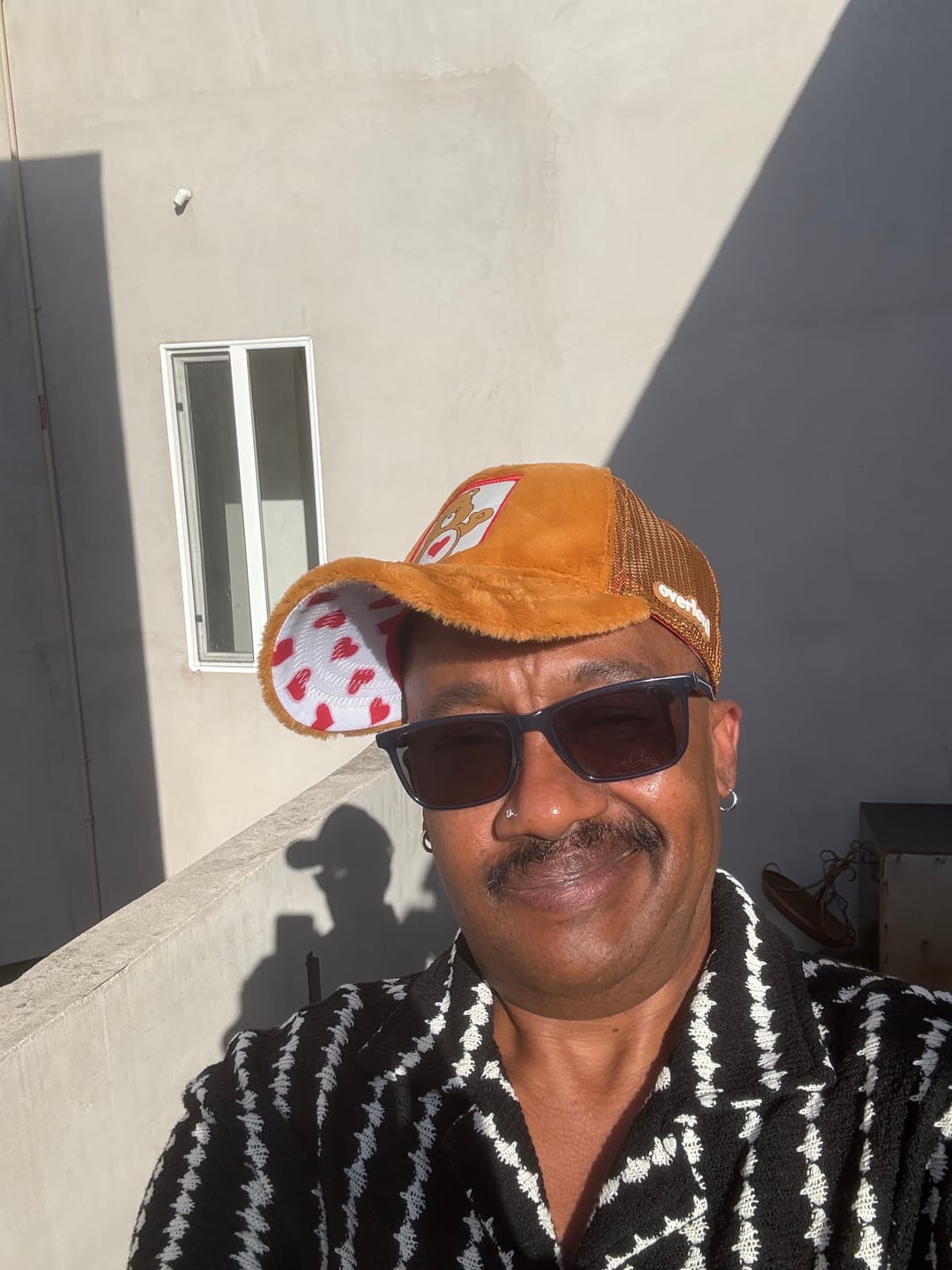 Customer photo review of OVERLORD X Care Bears:  Love-A-Lot Bear Trucker Cap
