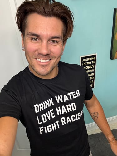 Customer photo review of Drink Water Fight Racism Unisex T-shirt