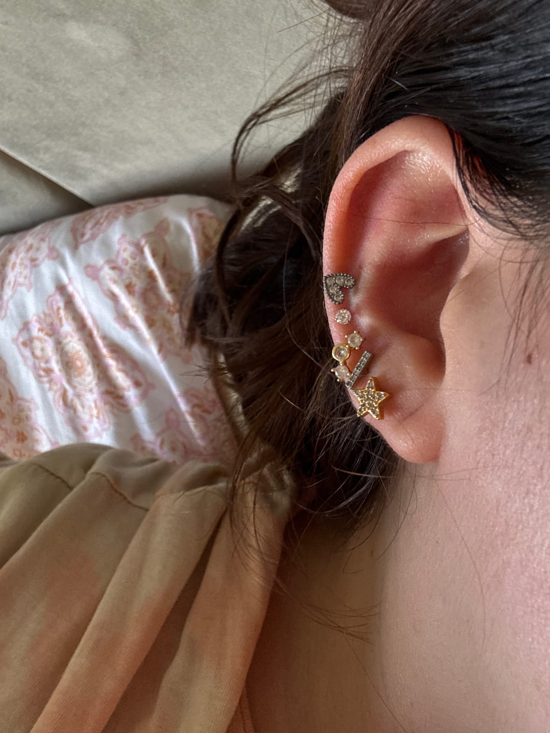 Customer photo review of Acero Quirúrgico Dorado Con Zirconias Primera Perforación