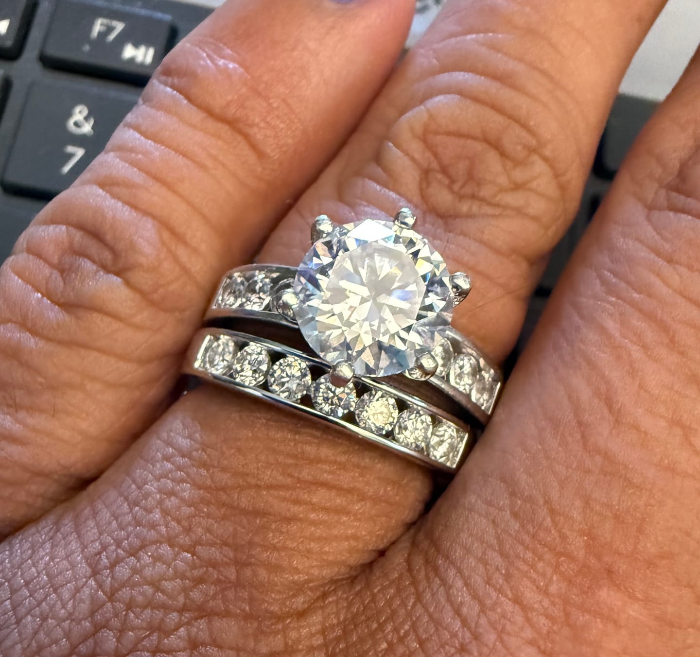 Customer photo review of Channel Set Moissanite Half Eternity Wedding Band Ring In Sterling Silver