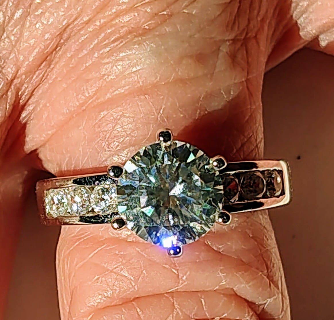 Customer photo review of Round Cut Moissanite Channel Set Engagement Ring