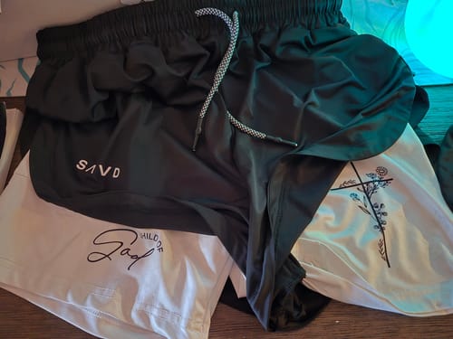 Customer photo review of 'Child of God' Women's Performance Shorts