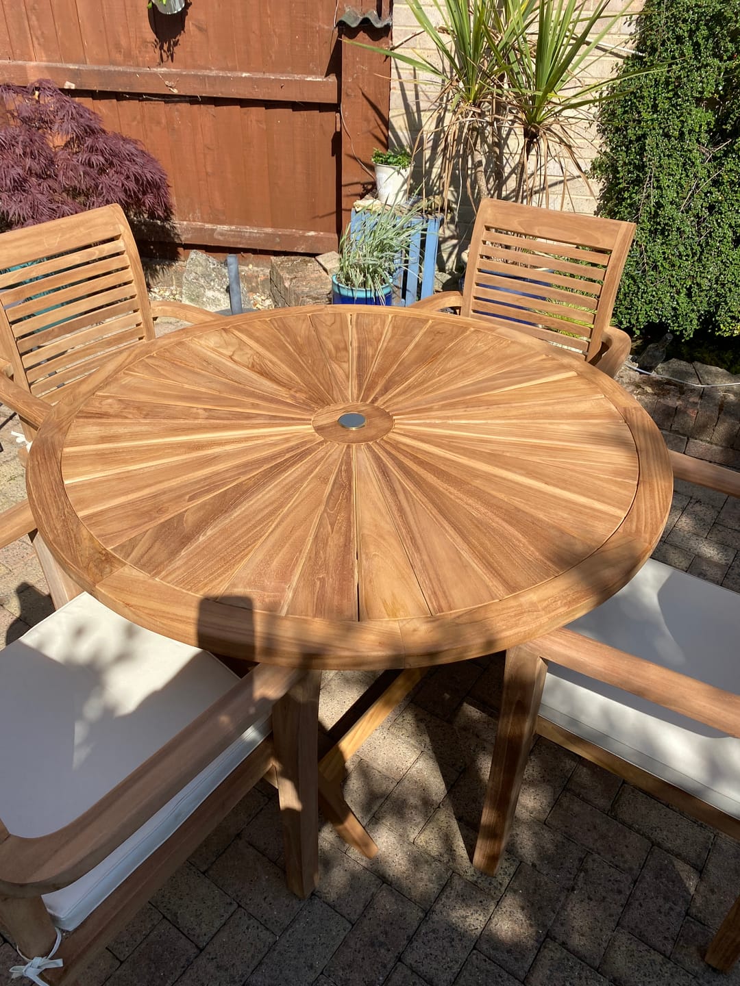Customer photo review of Teak Garden Furniture Set 120cm Round Sunshine Table 4 x Oxford Stacking Chairs Cushions Included