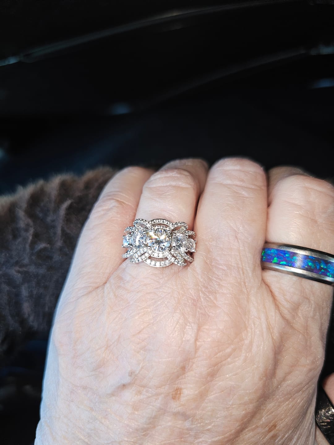 Customer photo review of Five Stone Round Moissanite Multi-Row Crossover Pave Engagement Ring