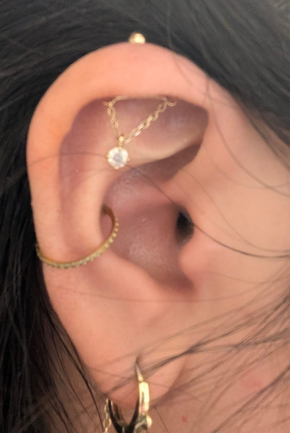 Customer photo review of 14K Gold Moissanite Dia Hidden Helix Drop Cubic Earring 20G18G16G