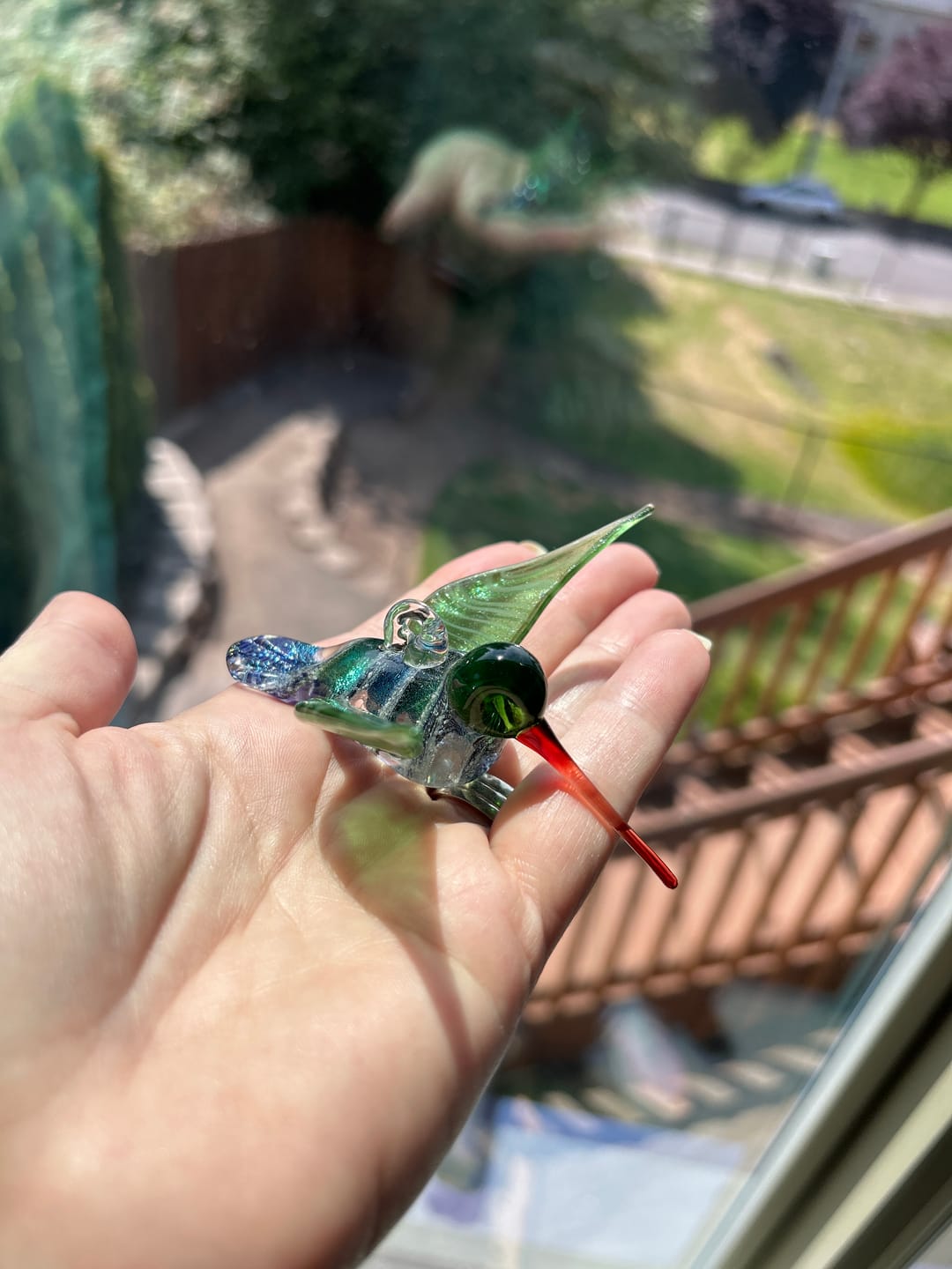 Customer photo review of Dichroic Twist Glass Hummingbird with Infused Ash