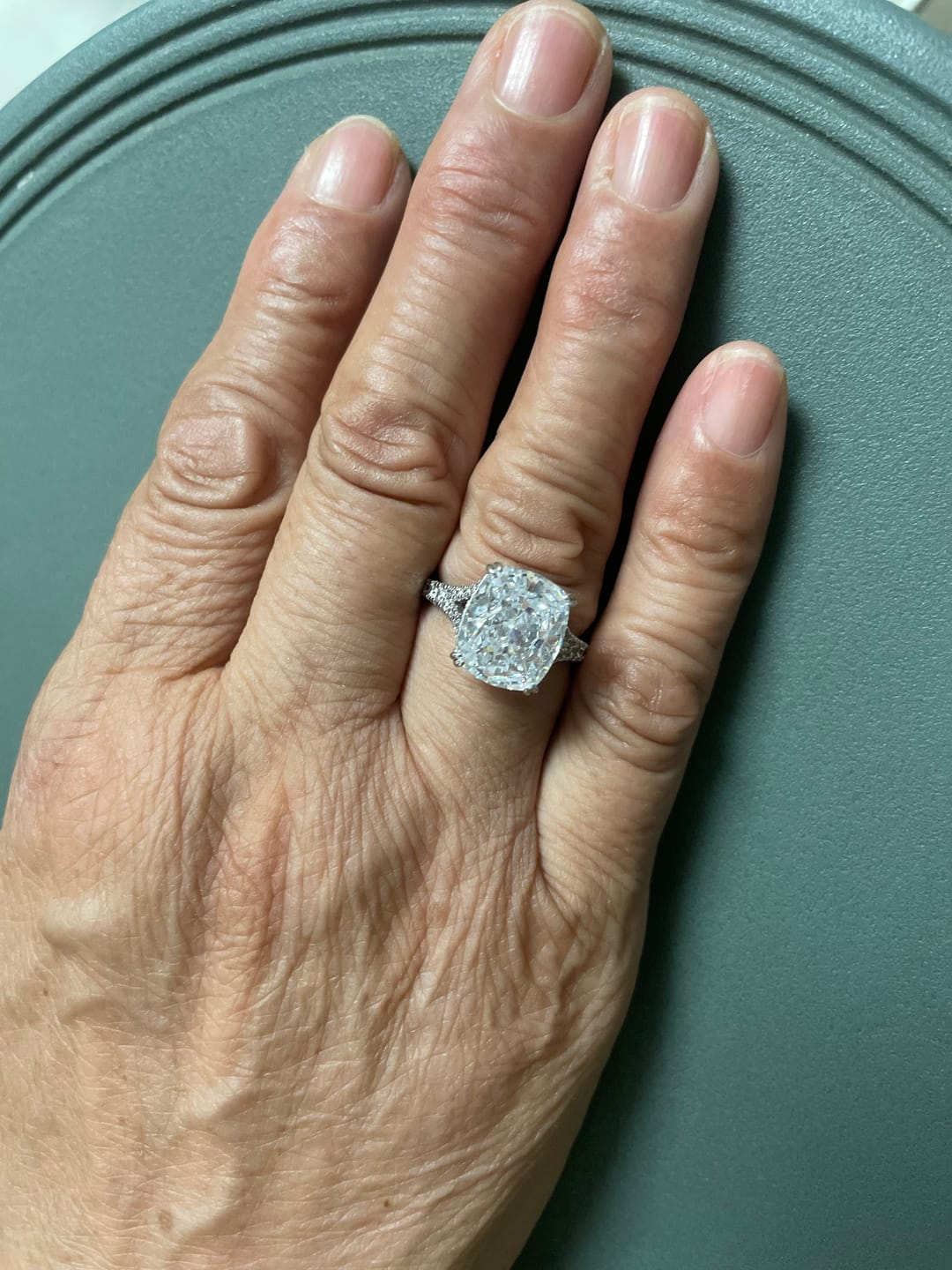 Customer photo review of S925 7.0Ct/4.0Ct Split Shank Cushion Cut Engagement Ring 18K White Gold Plated Travel Rings with Pavé Accents