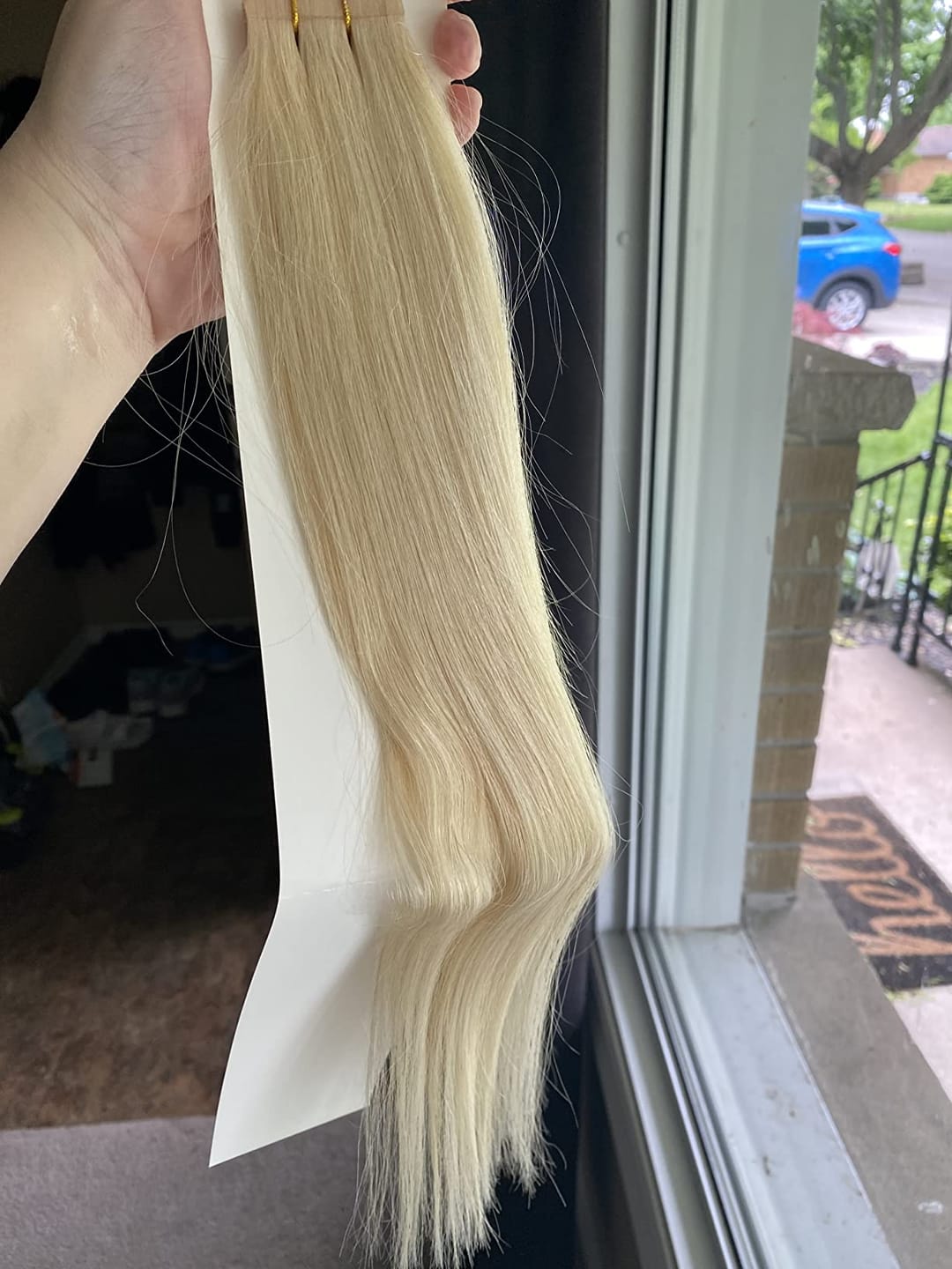 Customer photo review of Seamless Tape in Hair Extensions Best Virgin Hair Lightest Blonde #60