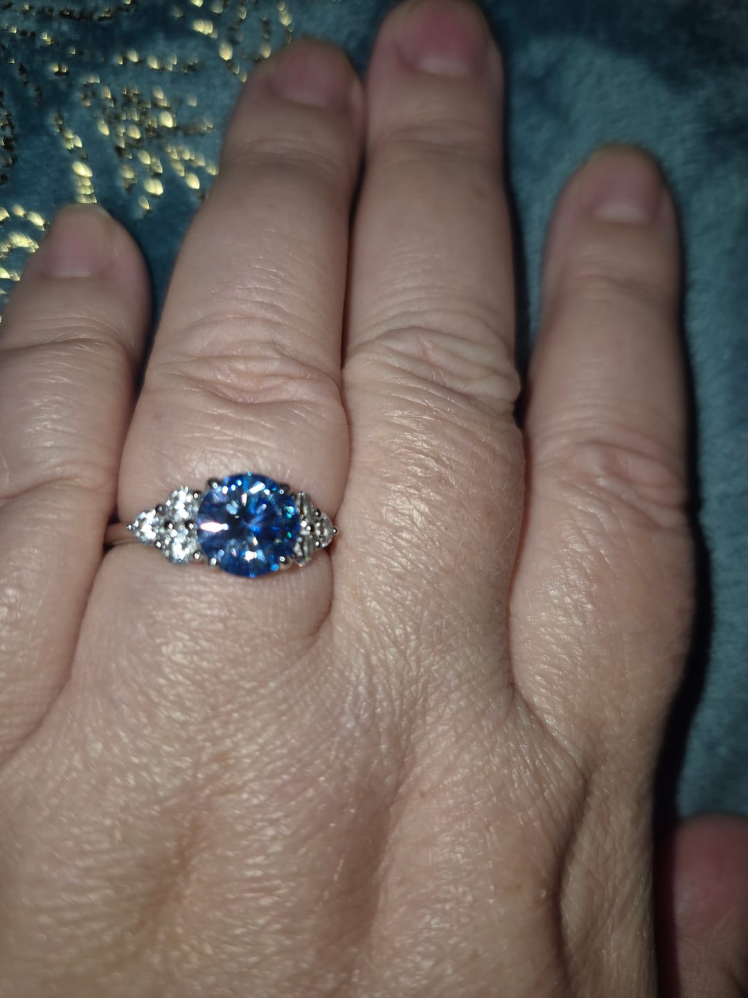 Customer photo review of Colored Round Moissanite Side Stone Engagement Ring